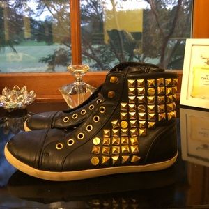 Black and gold studded sneakers